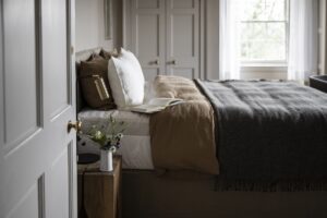 bedroom with textured bed linen and woolen throws
