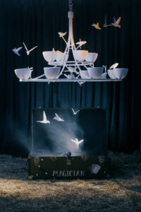 porcelain chandelier with teacup and bird detail