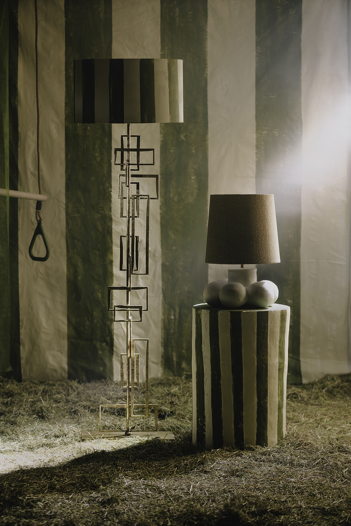 green striped wall with striped pedestals and lamps