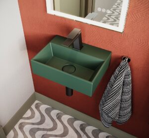 green patterned floor tiles with terracotta wall and green Crosswater hand basin