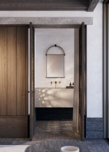bathroom with wood and stone surfaces view through wooden door