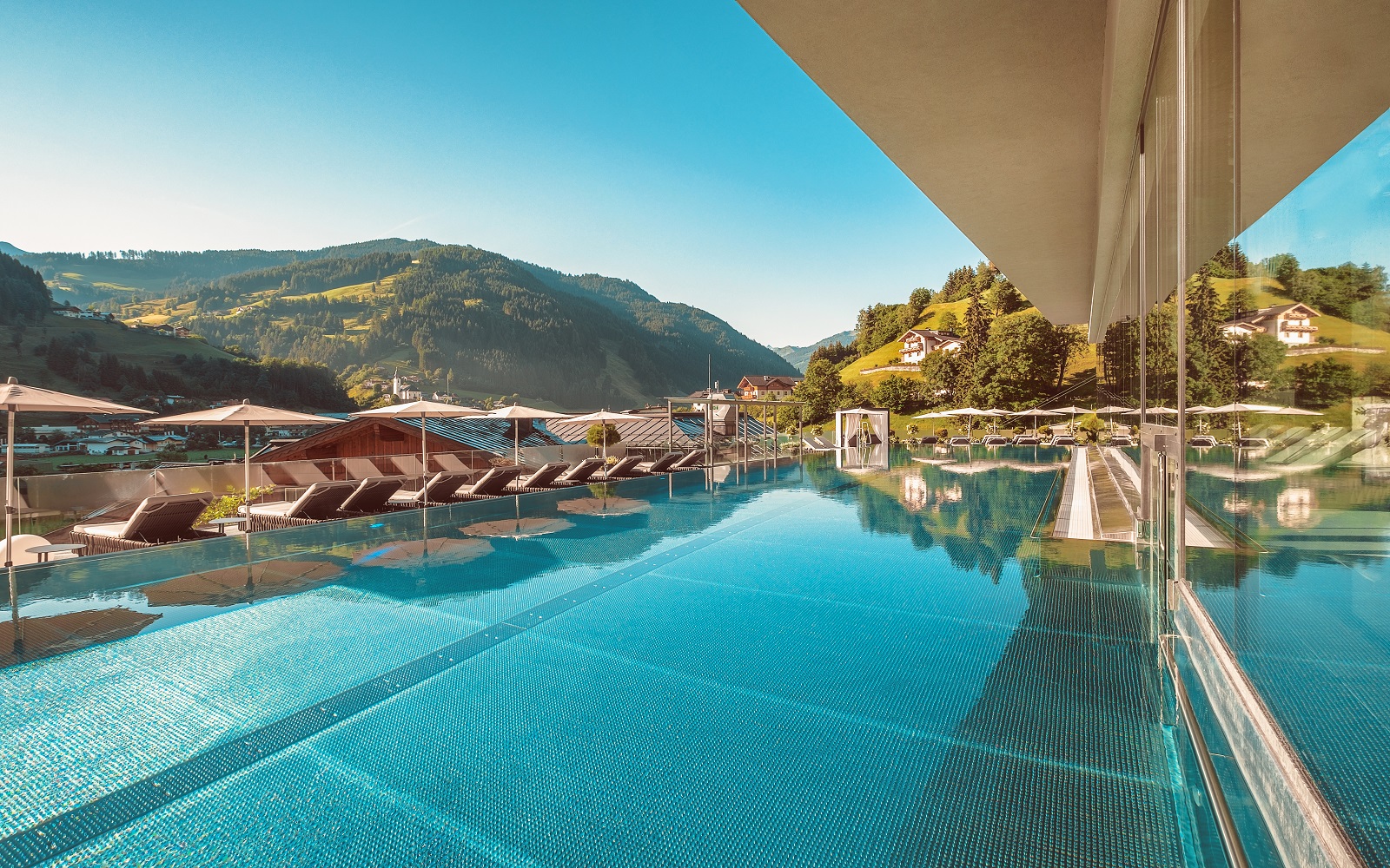 infinity pool and umbrellas at Das Edelweiss