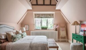 attic guestroom in pink with double bed from sofa.com facing green vanity