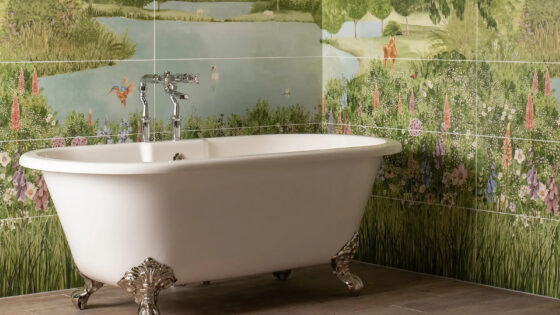Bath in front of tiled wall of landscape