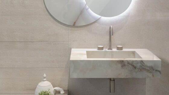 marble bathroom sink with mirror and stone wall in alpine from Bagnodesign