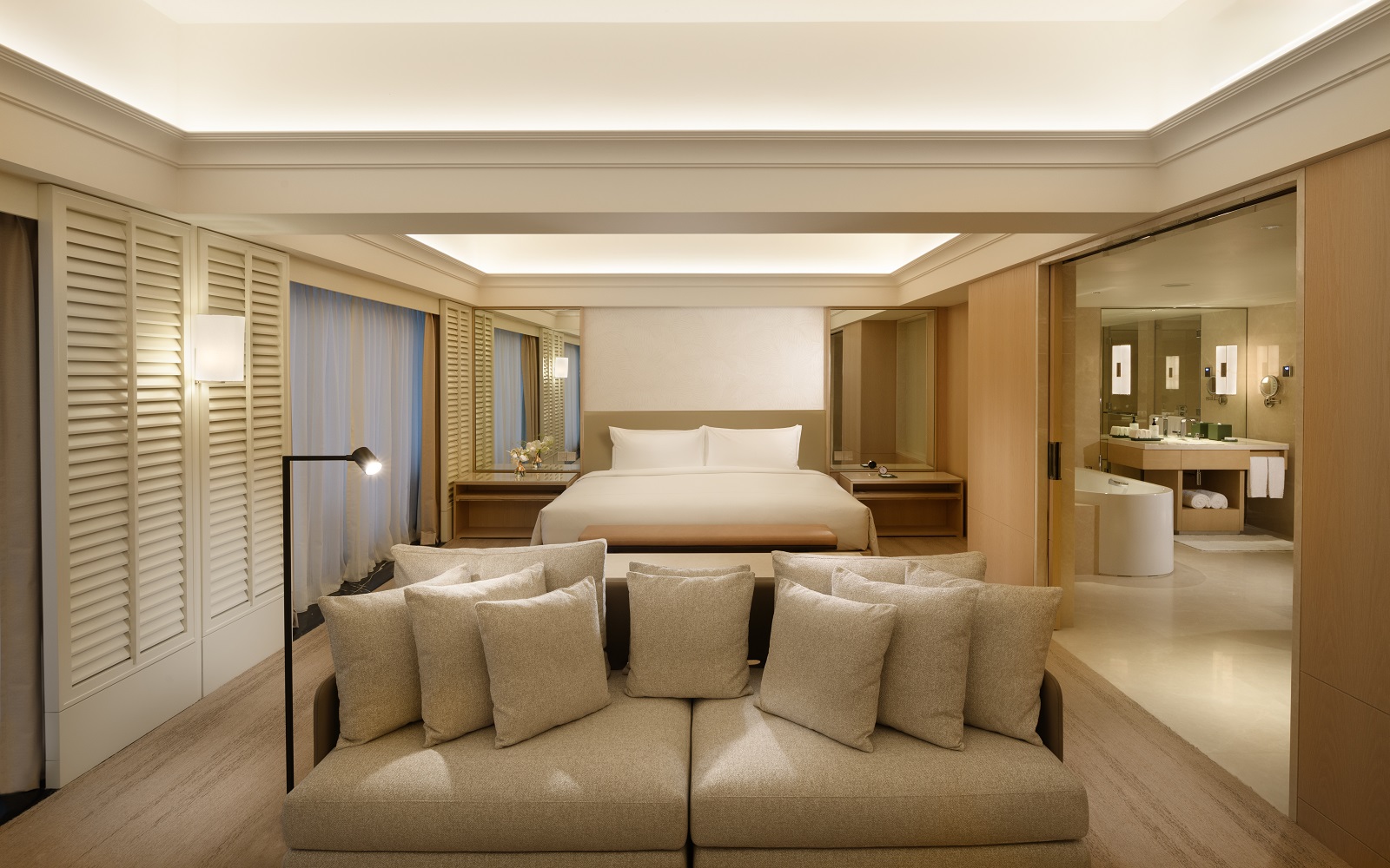 wood cream and beige interior in guestroom at Conrad Orchard Singapore