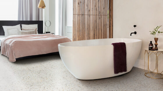 Bath in hotel suite with terrazzo tiles