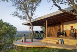 fitness area opening onto deck with views above and over the bush