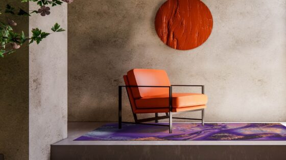 orange chair against concrete wall with patterned carpet and sculptural orange disc on wall