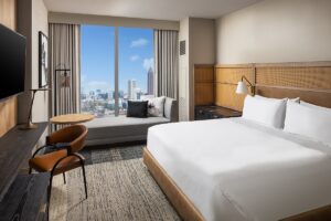 guestroom in signia by hilton Atlanta with view over city skyline