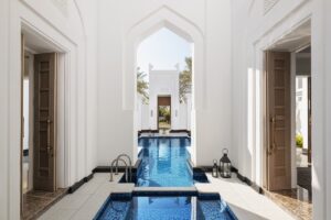 indoor and outdoor spaces and water features in private villa at Raffles Al Areen Palace Bahrain