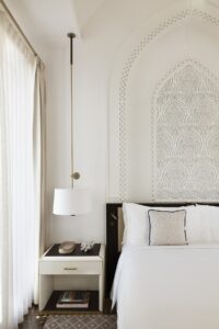 white on white guestroom with arabic inspired surface decoration
