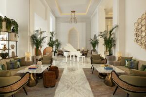 lobby and seating area with palm trees and white baby grand piano