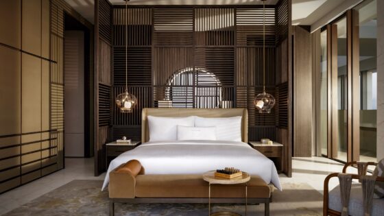 guestroom in shades of taupe and wood with white bed linen in Atlantis The Royal