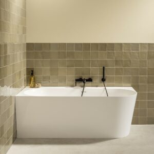 freestanding bath with black exterior and white interior surface.