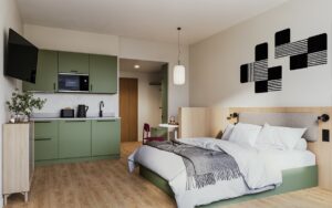 double bed in front of open plan kitchen are in Bob W aparthotel