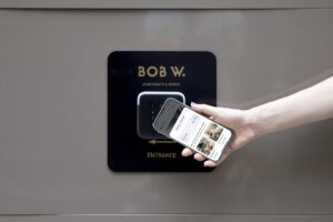 using a phone for digital check-in at Bob W