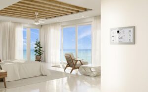 white on white hotel guestroom with wooden ceiling and floor to ceiling windows with ocean view