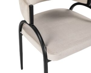 chair with black frame upholstered in cream recycled fabric