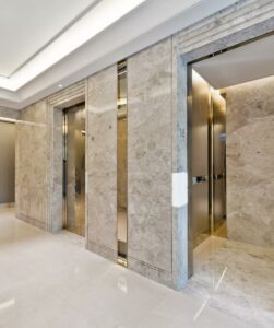 hotel lift with walls clad in marble architextural surface