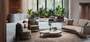 wood effect architectural surface in hotel lobby with chairs, couch and table