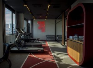 gym with neon sign and view across Belgrade