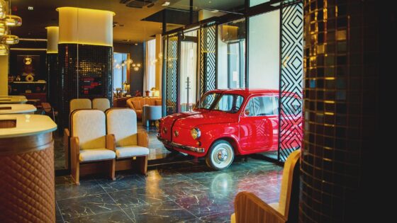 Lobby in Radisson Red Belgrade with red car in entrance