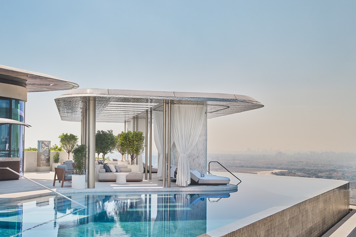 rooftop poolside cabanas and loungers along the pool at The Lana Dubai