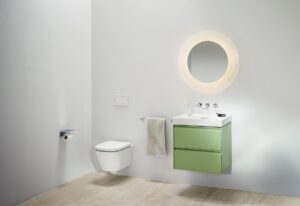 wall hung toilet, olive green unit with white basin and backlit mirror by Laufen