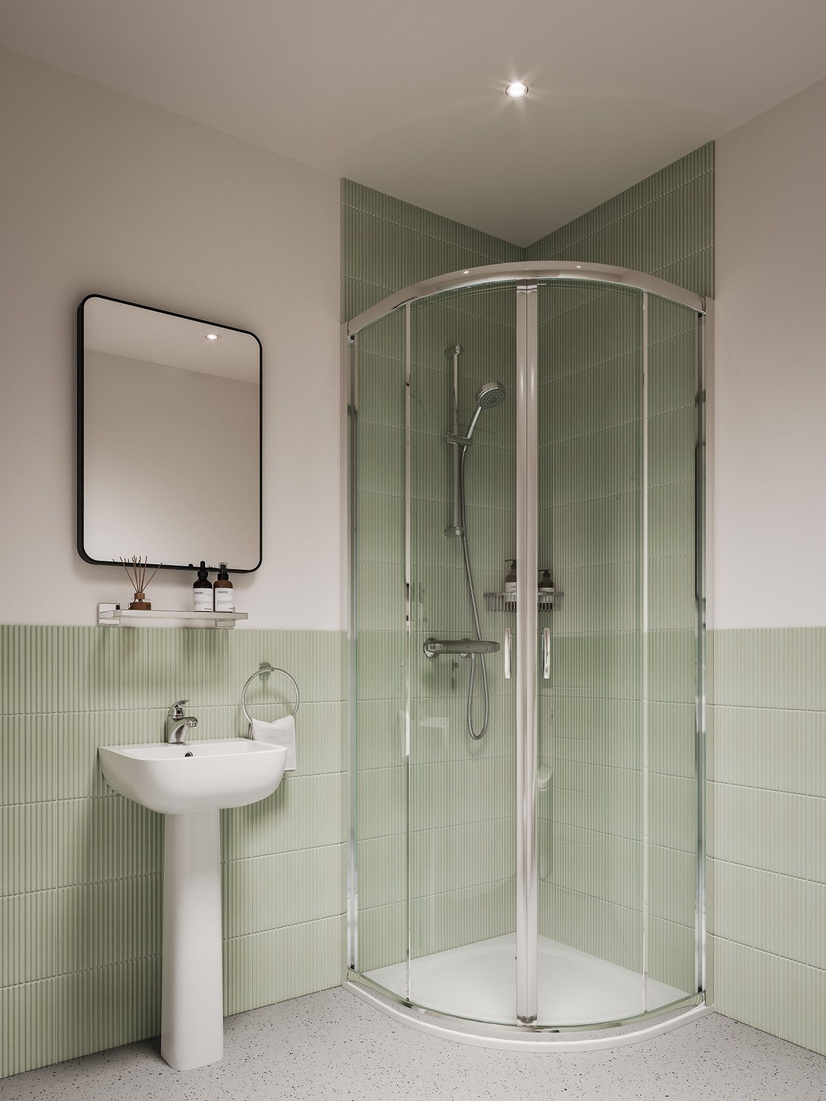 shower and basin in aparthotel bathroom with green tiles