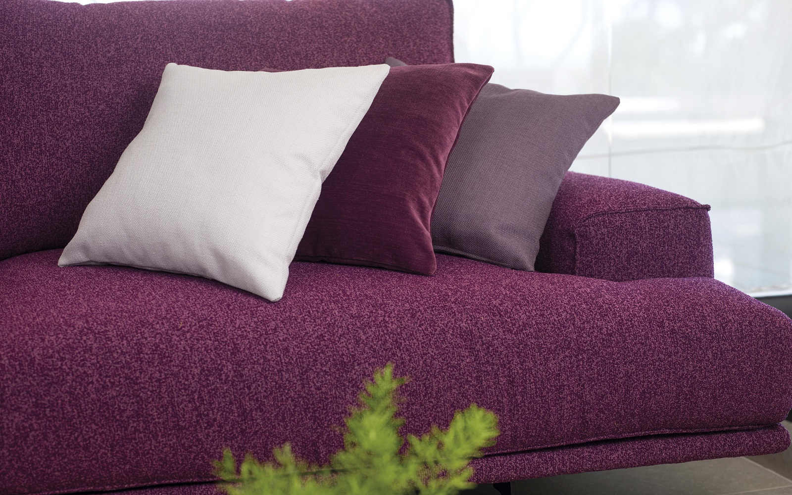 sofa and cushions in shades of purple in Sekers Garcia fabric collection