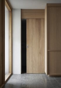 wooden doors in corridor with d line fittings