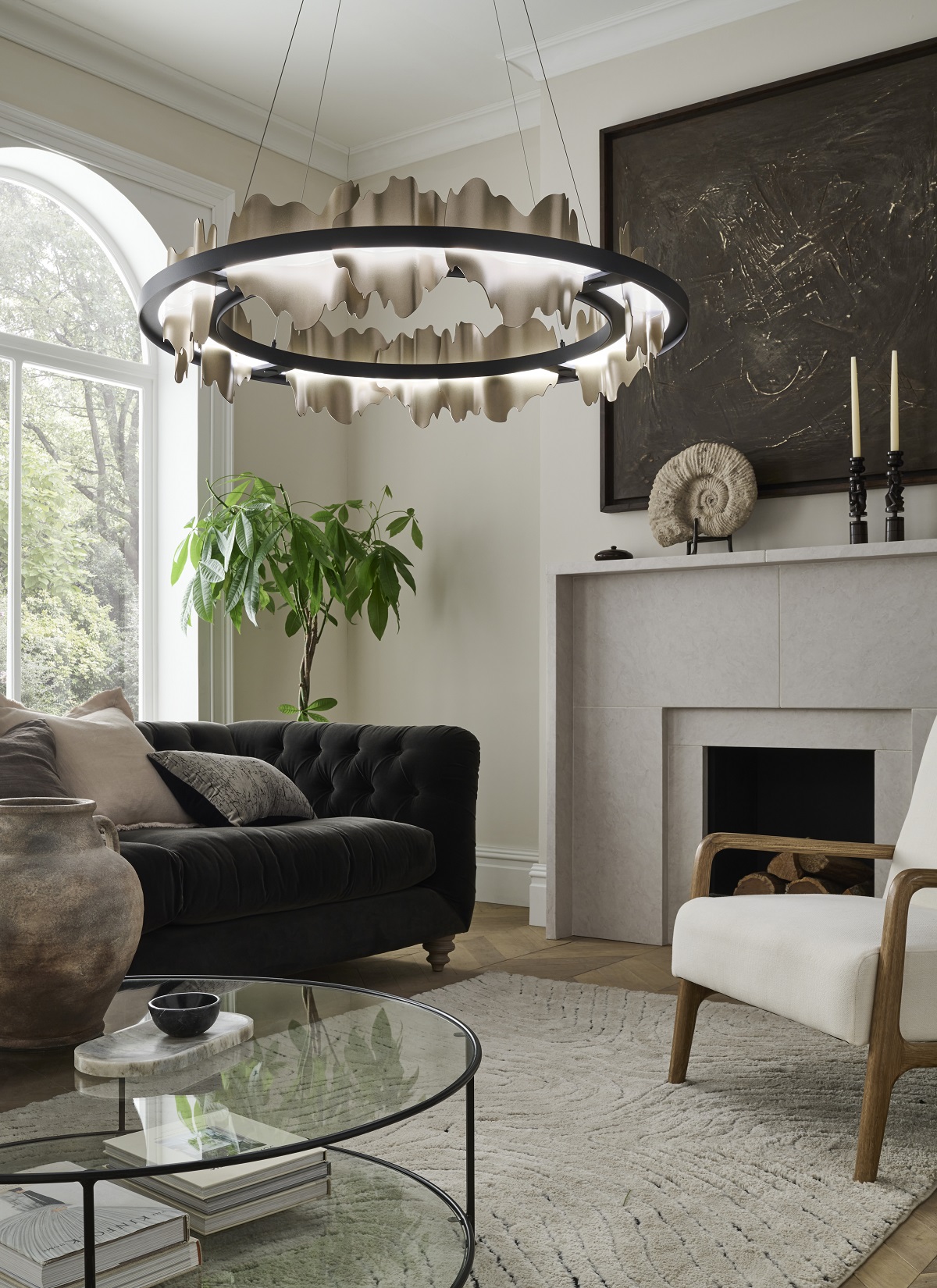 round central light designed by Christopher Hyde above glass coffee table in lounge