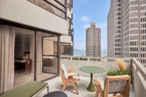 private guestroom terrace at The Jay showing concrete exterior and view of San Francisco