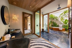 W Punta de Mita bathroom with outdoor bath and wood and stone surfaces
