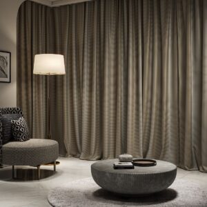 room set with floor length curtains and upholstered chair in Zavian from Sekers