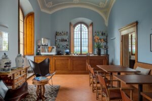 wooden bar and tables and chairs in restored Tuscan villa hotel