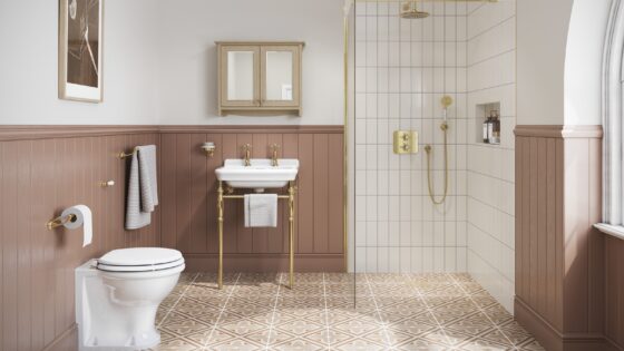bathroom with patterned floor and panelled wall as backdrop for Burlington Guild fittings