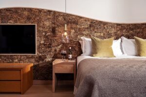 Hypnos bed against cork wall