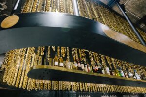 gold chain lighting design detail above hotel bar