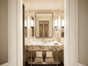 marble and white period style bathroom in Rosewood hotel in Austria