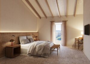 beamed ceiling and stone walls with view onto Mallorcan countryside from the guestroom