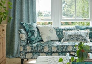 sofa in front of window covered in botanical Morris print
