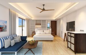 caribbean hotel guestroom with ceiling fan and view to the ocean
