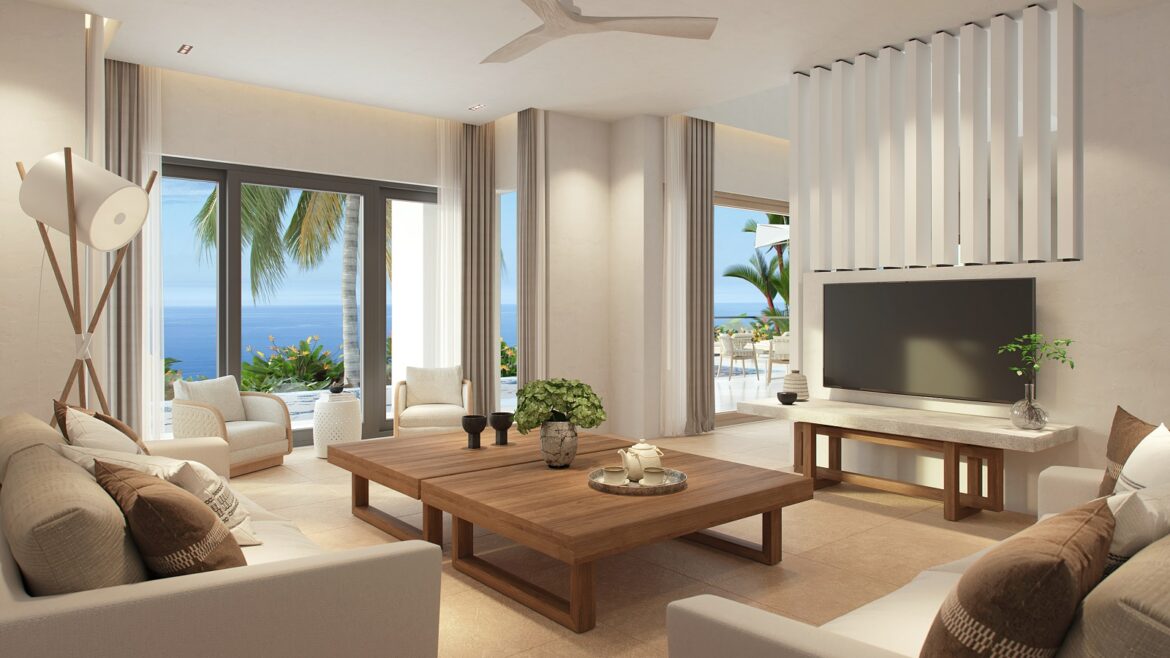 seating area in villa overlooking a pool and the sea