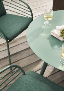 green outdoor table and chair on wooden deck from BoConcept