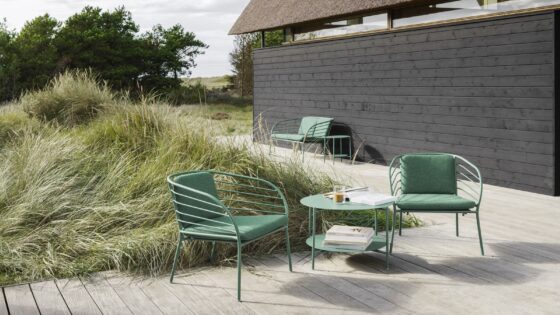green outdoor BoConcept furniture on wood deck