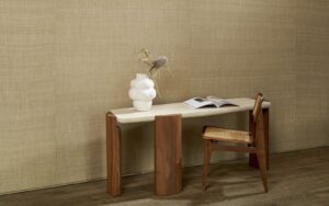 wooden table and chair with white vase against natural silk wall covering from Arte