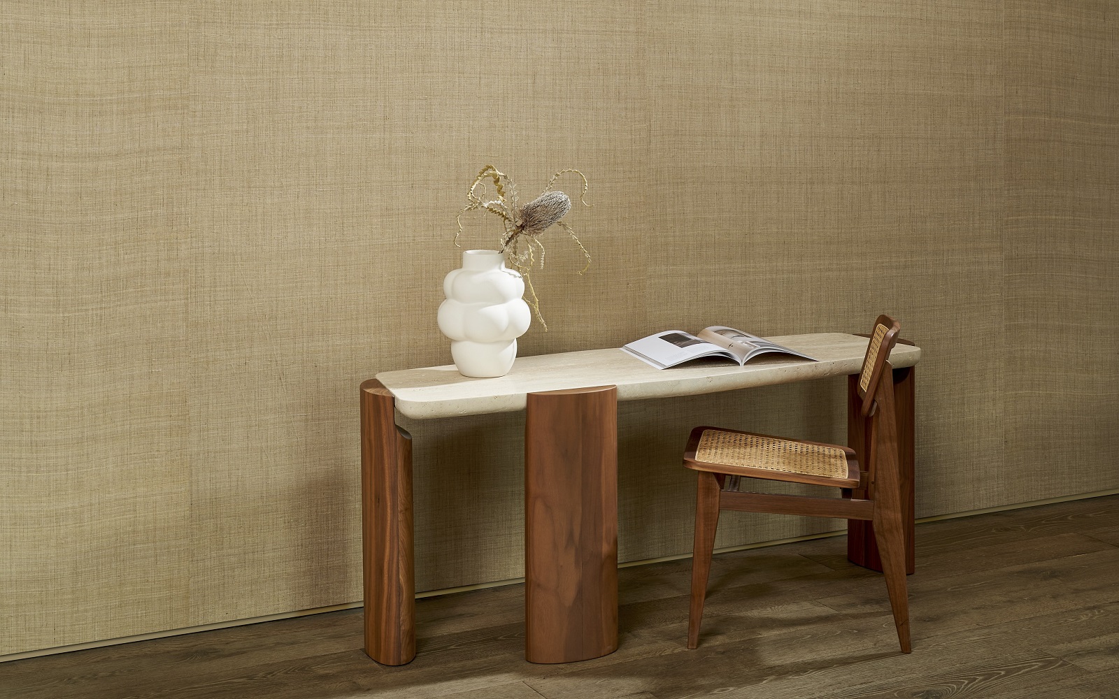 wooden table and chair with white vase against natural silk wall covering from Arte