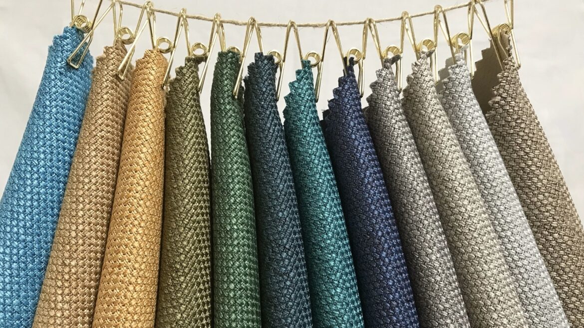 celeste fabric samples from Skopos pegged to a cord on display